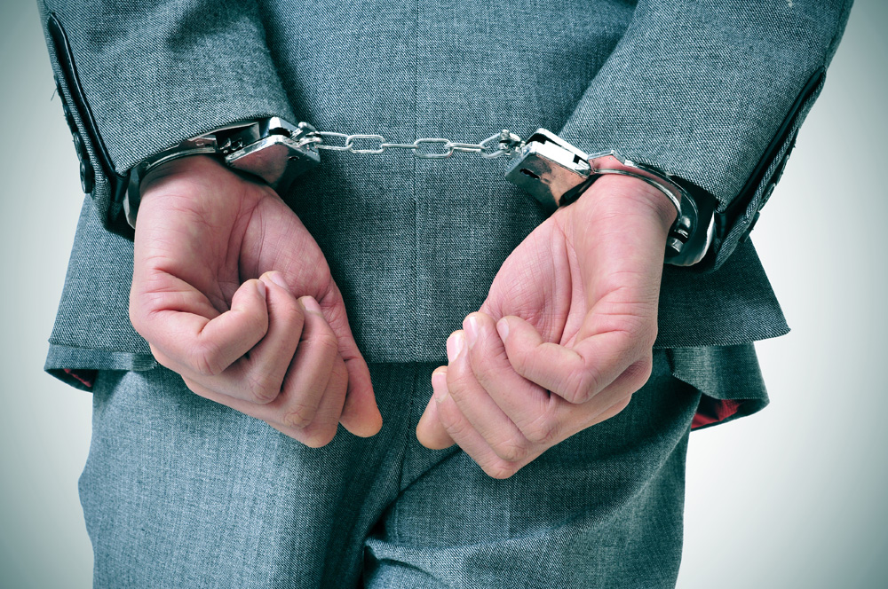 Businessman in handcuffs